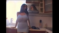 Mature woman with giant tits masturbating in the kitchen