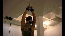 Naked honey stands with her big boobs tied up in ropes