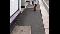 Sexy blonde wearing thong walking up the street