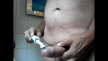 Bathroom - jerk off and cum with a toothbrush