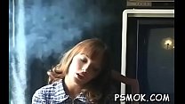 Mature slut blows a dude while smoking a cigarette