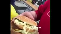 His friend dared him to eat a whole burger at once