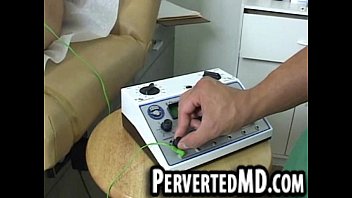 Sexy hunk patient has a toy put on his cock by the doctor