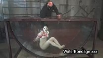 Brunette in rope bondage dive in water