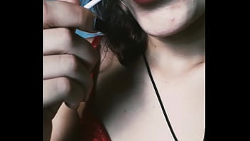 Naughty sucking a lollipop and passing her pussy
