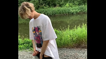 cute boy jerking off in the forest by the lake