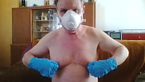 Andreas with a dust mask and gloves picks one off