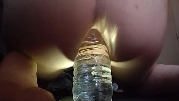 Femboy fucks water bottle  in his ass